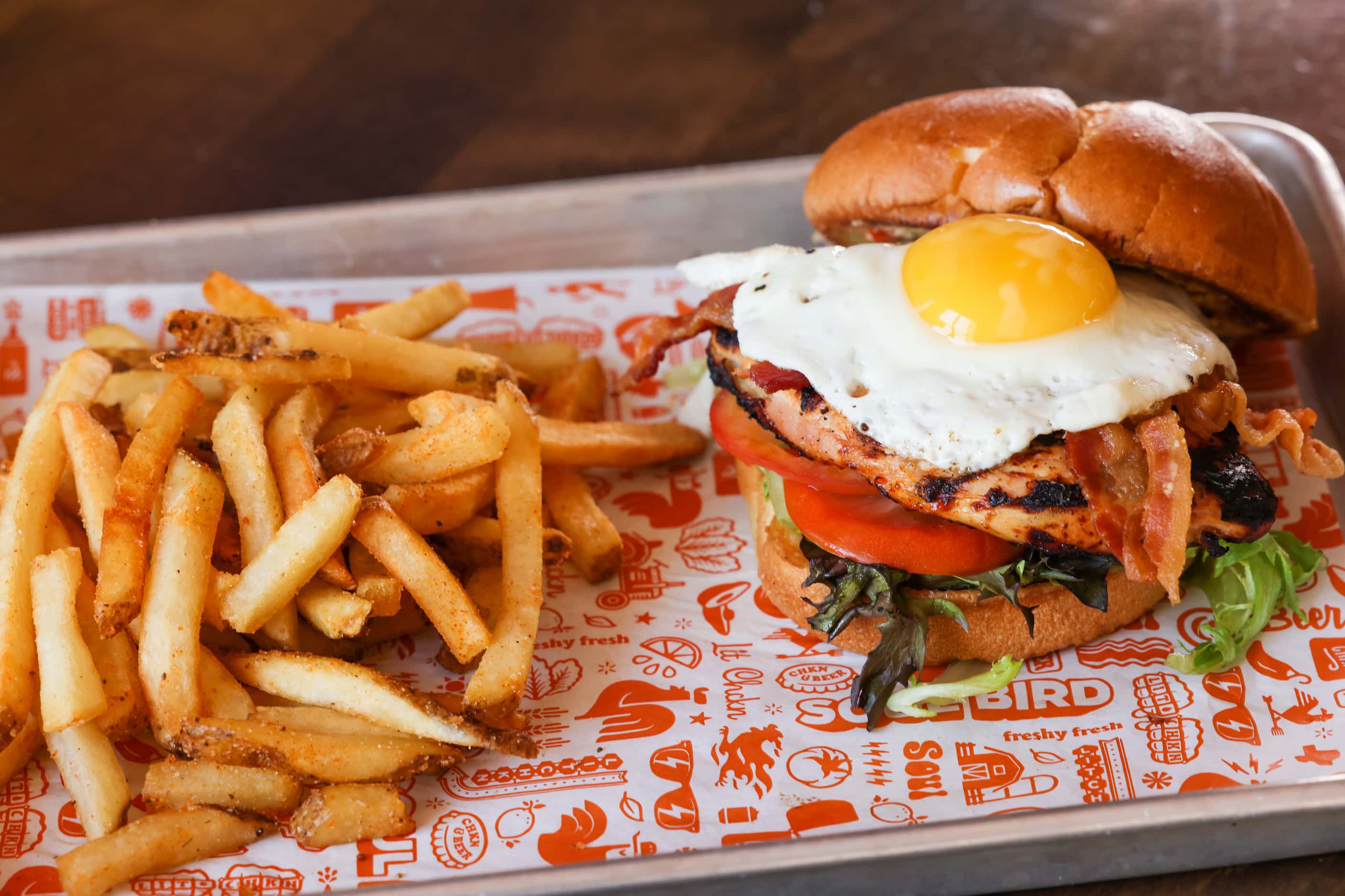 Soul Bird menu options include The Shack burger, made with Applewood smoked bacon, greens,...