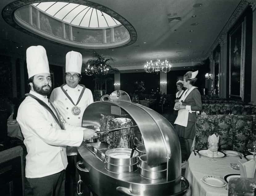 Chefs Ralph Sanchez and Lee Davis, of Lawry's The Prime Rib, slice meat in December 1983.