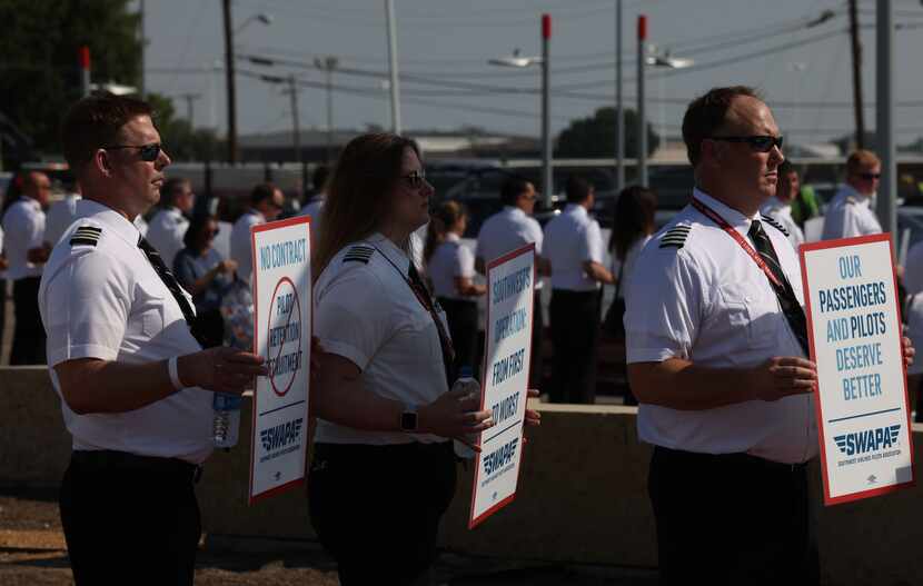 Southwest Airlines Pilots stand picketing for better work conditions, on Tuesday, June 21,...