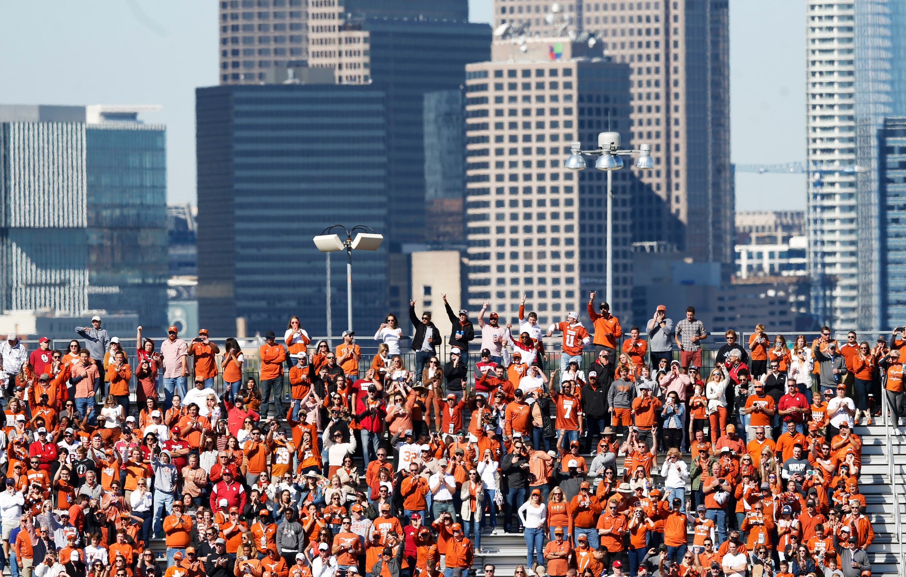 Texas Longhorns fans cheer as their team takes the field before a game against the Oklahoma...