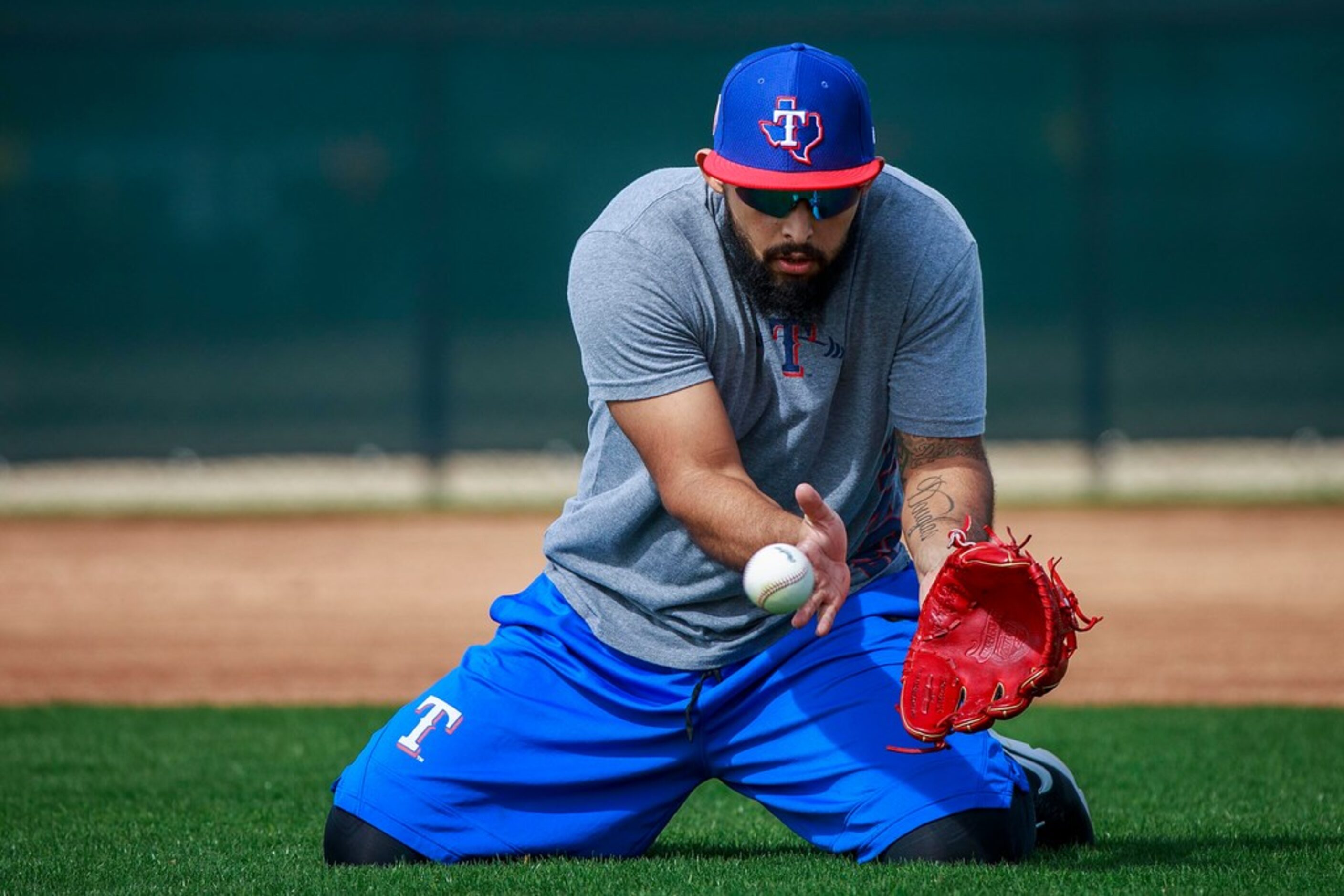 Texas Rangers infielder Rougned Odor takes infield practice during a spring training workout...