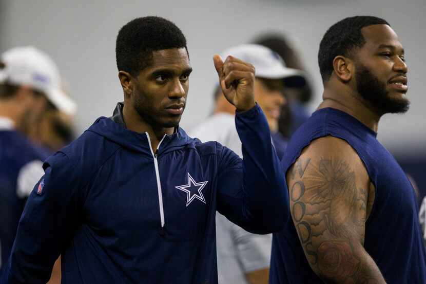 Dallas Cowboys cornerback Byron Jones (31, left) makes his way down the sideline during a...