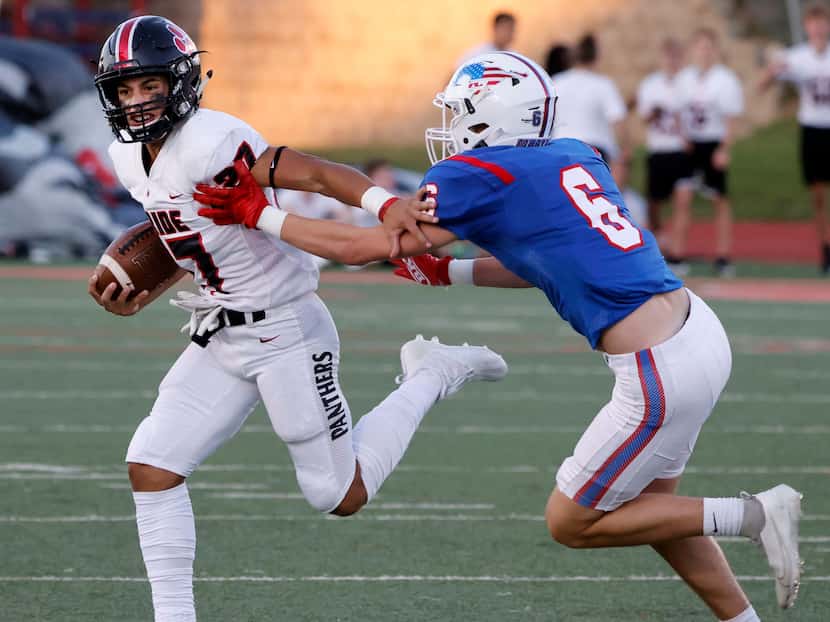 Colleyville Heritage running back Riley Wormley (27) tries to get out of the grasp of...
