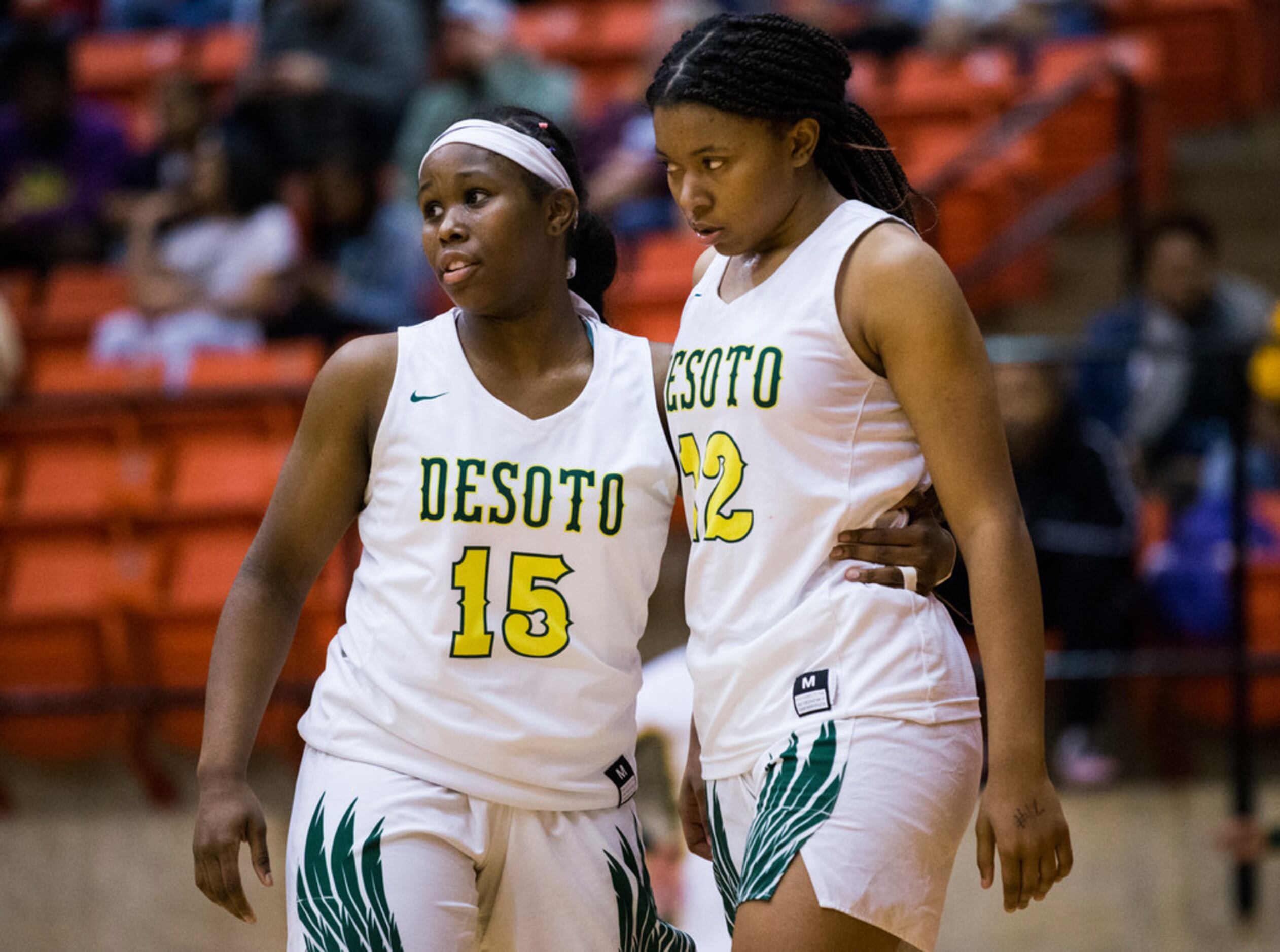 DeSoto's Michayla Gatewood (15) and Jiya Perry (12) react to a 47-43 loss after a Class 6A...