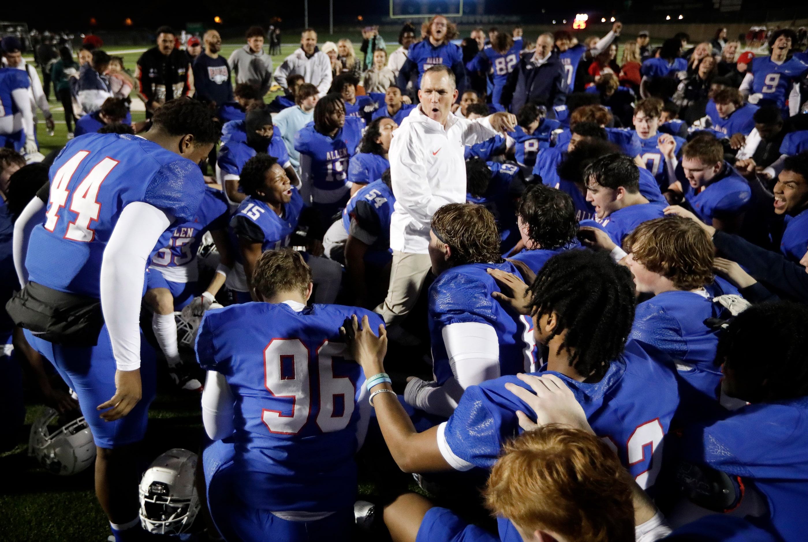 Allen head coach Lee Wigginton (center) is fired up after linebacker Chandler Bryant (44)...