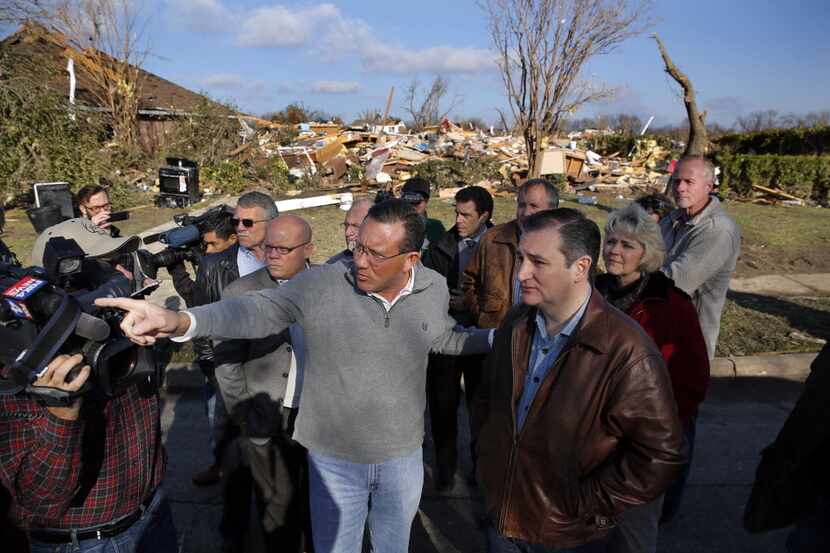  Rowlett Mayor Todd Gottel (center, left), shows tornado ravaged areas on Harbor Drive to...