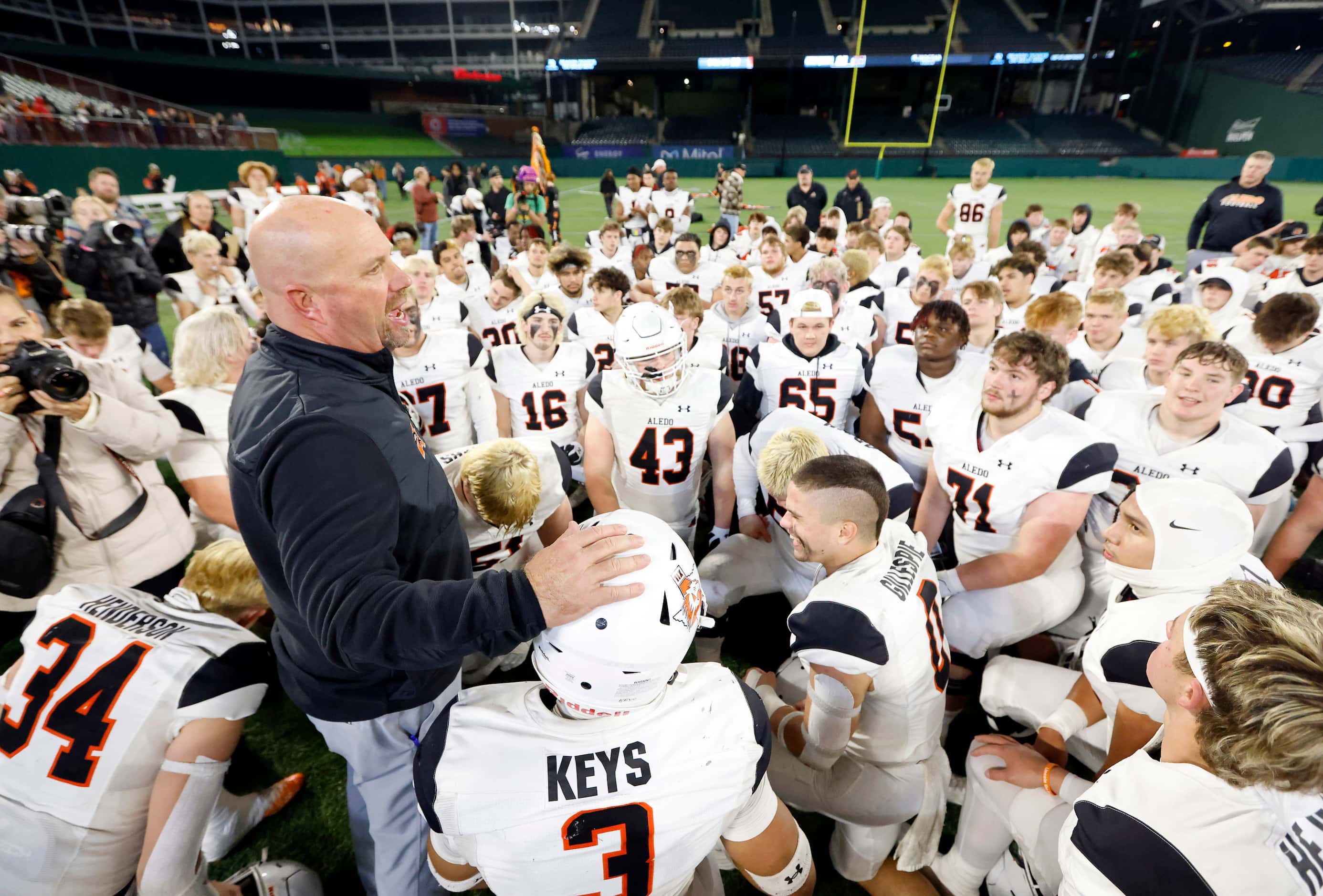 Aledo head coach Robby Jones speaks to his players following their their Class 5A Division I...