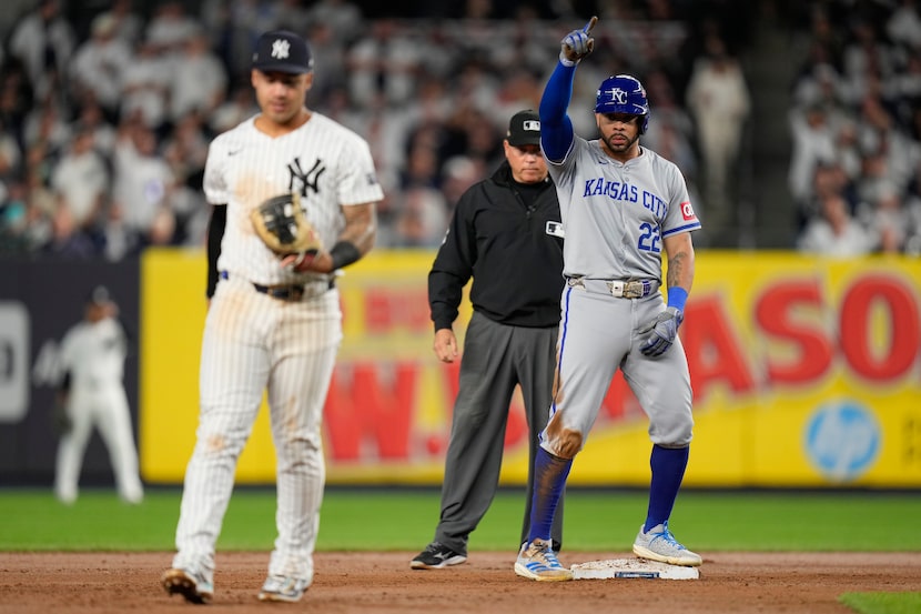 Kansas City Royals Tommy Pham (22) reacts after driving in a run against the New York...