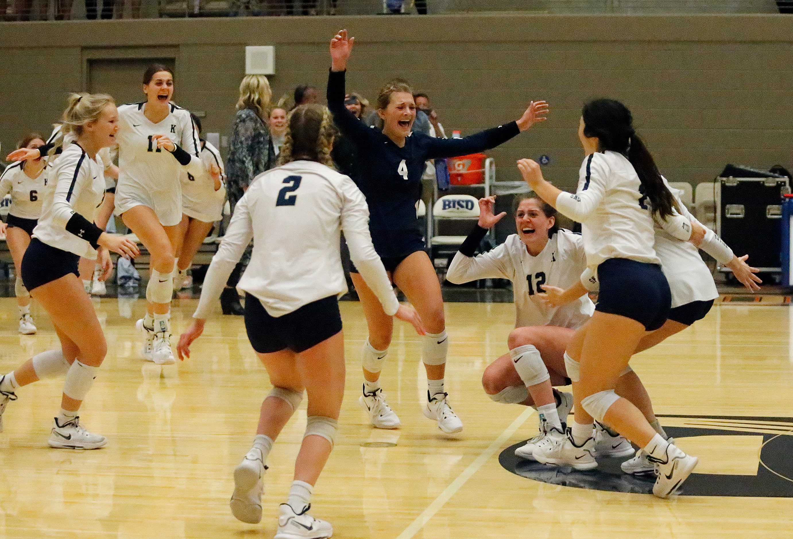 Keller High School liber Landry McEachern (4) rushes team mates as Keller High School...