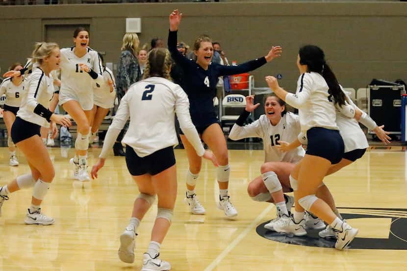 Keller libero Landry McEachern (4) rushes in to celebrate with her teammates after Keller...