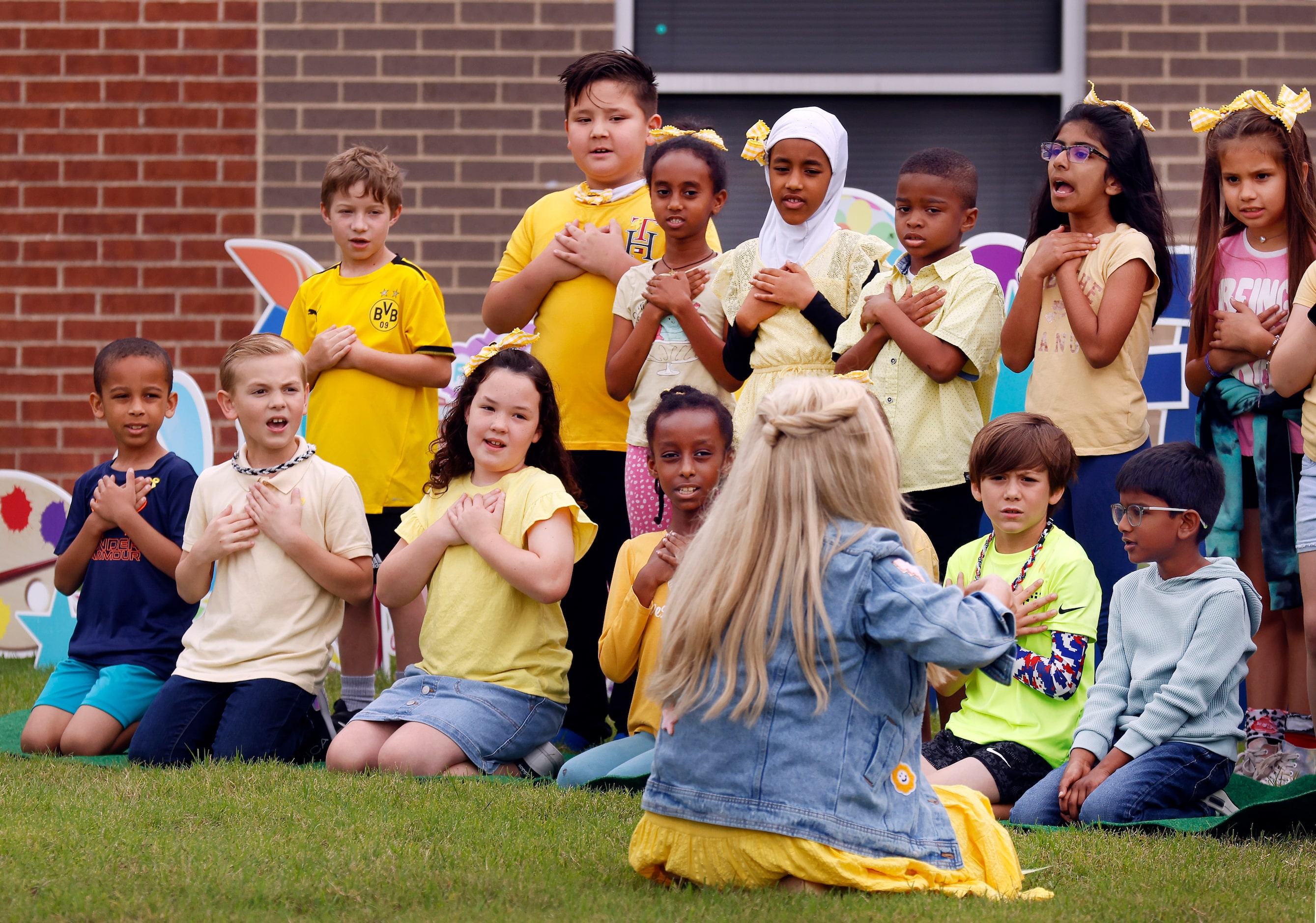 Seconds graders sing ‘The Sweetest Little Sisters’ written by and led by teacher Bobbie Jo...