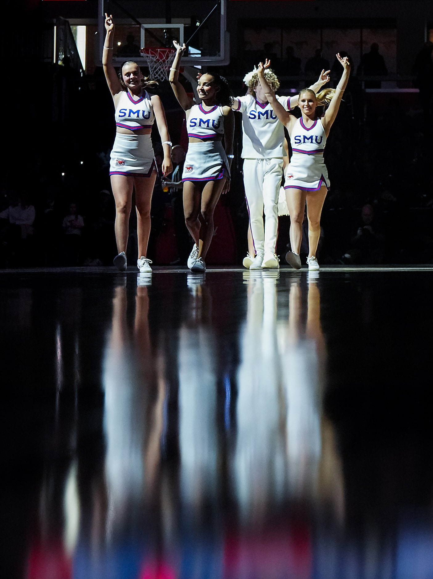 SMU cheerleaders wave to the crowd during the second half of an NCAA men’s basketball game...