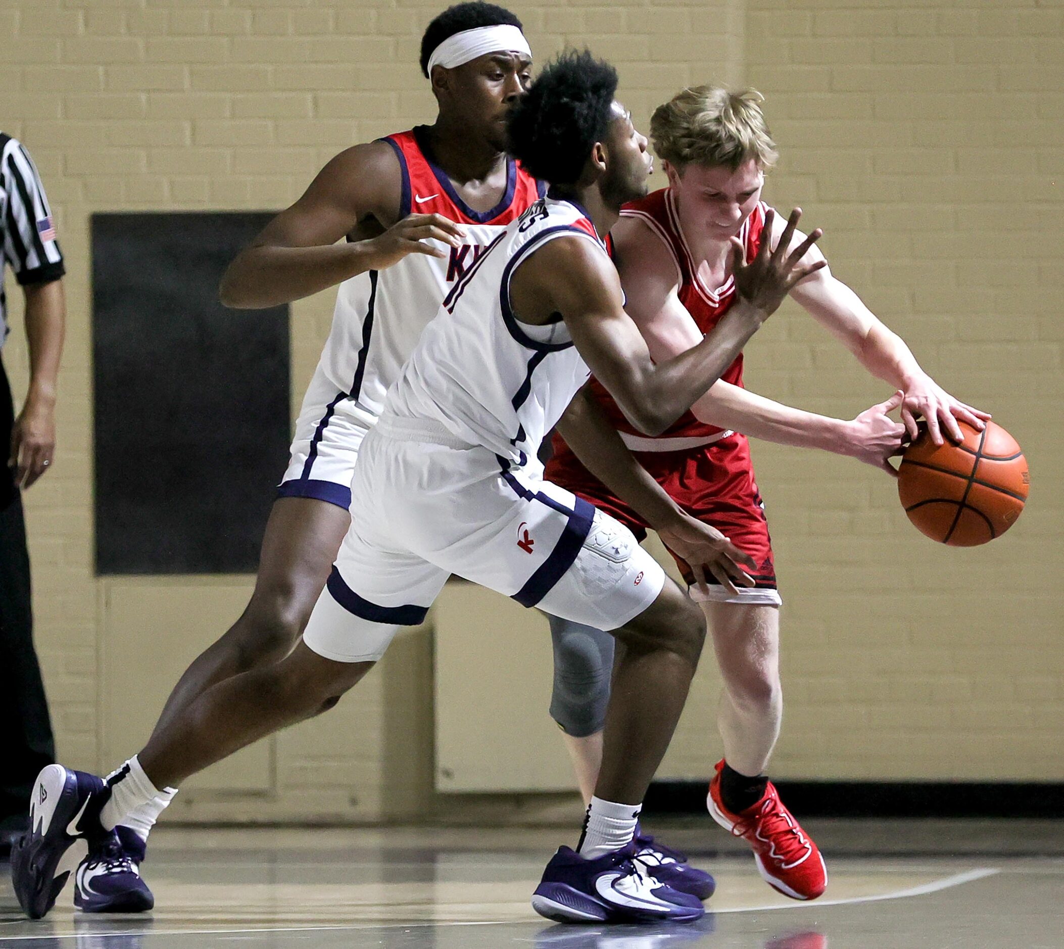 Woodrow Wilson guard Brian Kirby, (right) tries to get around Kimball forward Barack...