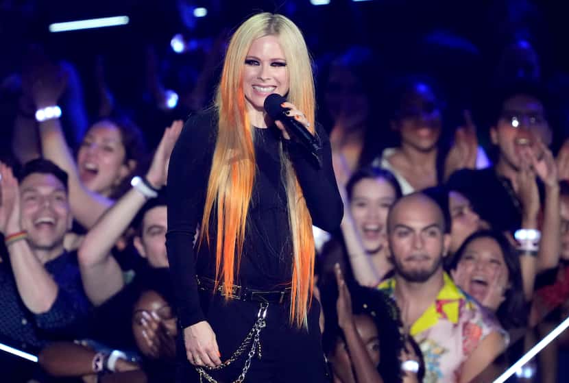Avril Lavigne speaks at the MTV Video Music Awards at the Prudential Center on Sunday, Aug....