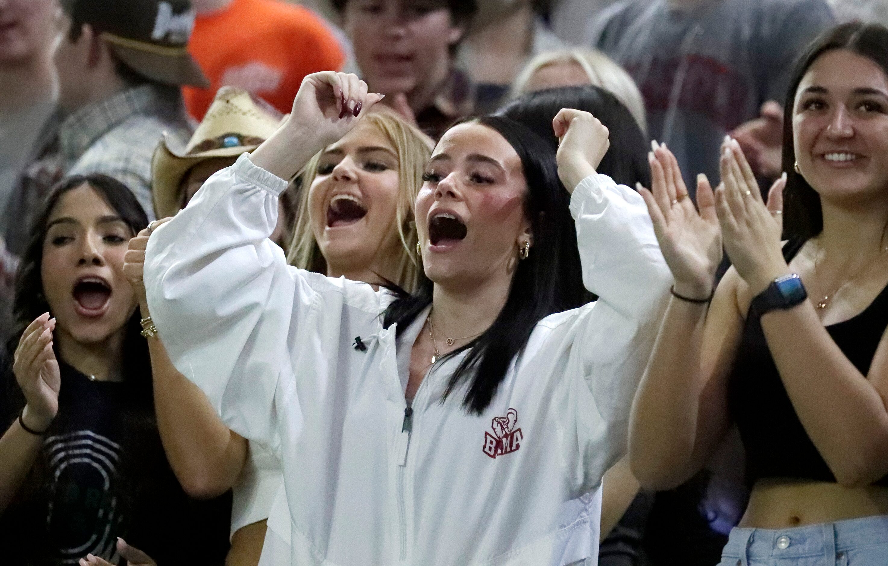 Reedy High School students cheer a touchdown during the first half as Reedy High School...