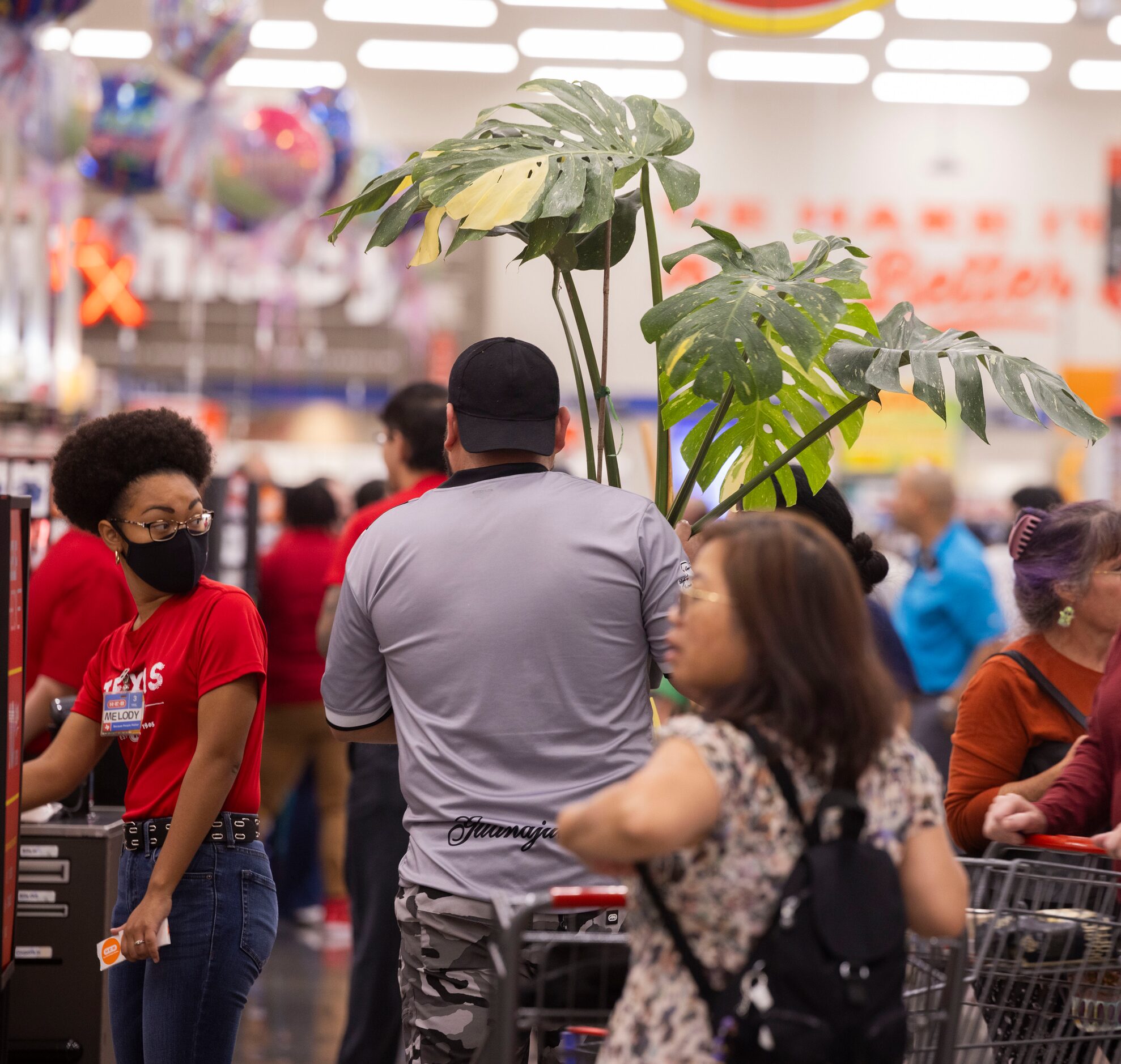 Customers shop during the grand opening of the H-E-B store in Allen on Wednesday, Oct. 4,...