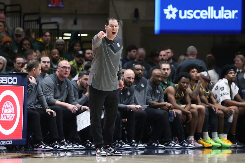 Baylor coach Scott Drew reacts during the first half of an NCAA college basketball game...