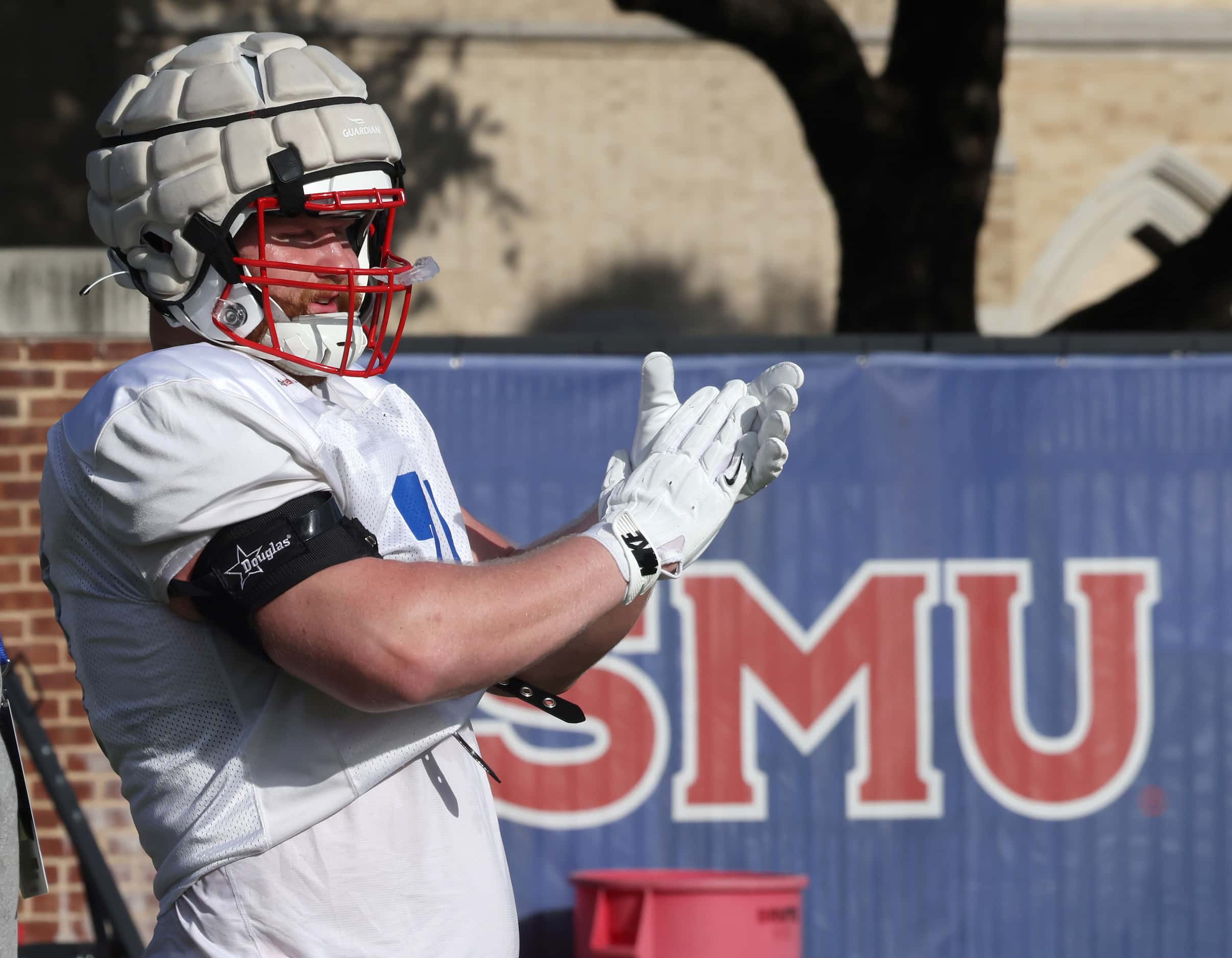 SMU Mustangs offensive lineman Logan Parr (71) applauded the effort of teammates during a...
