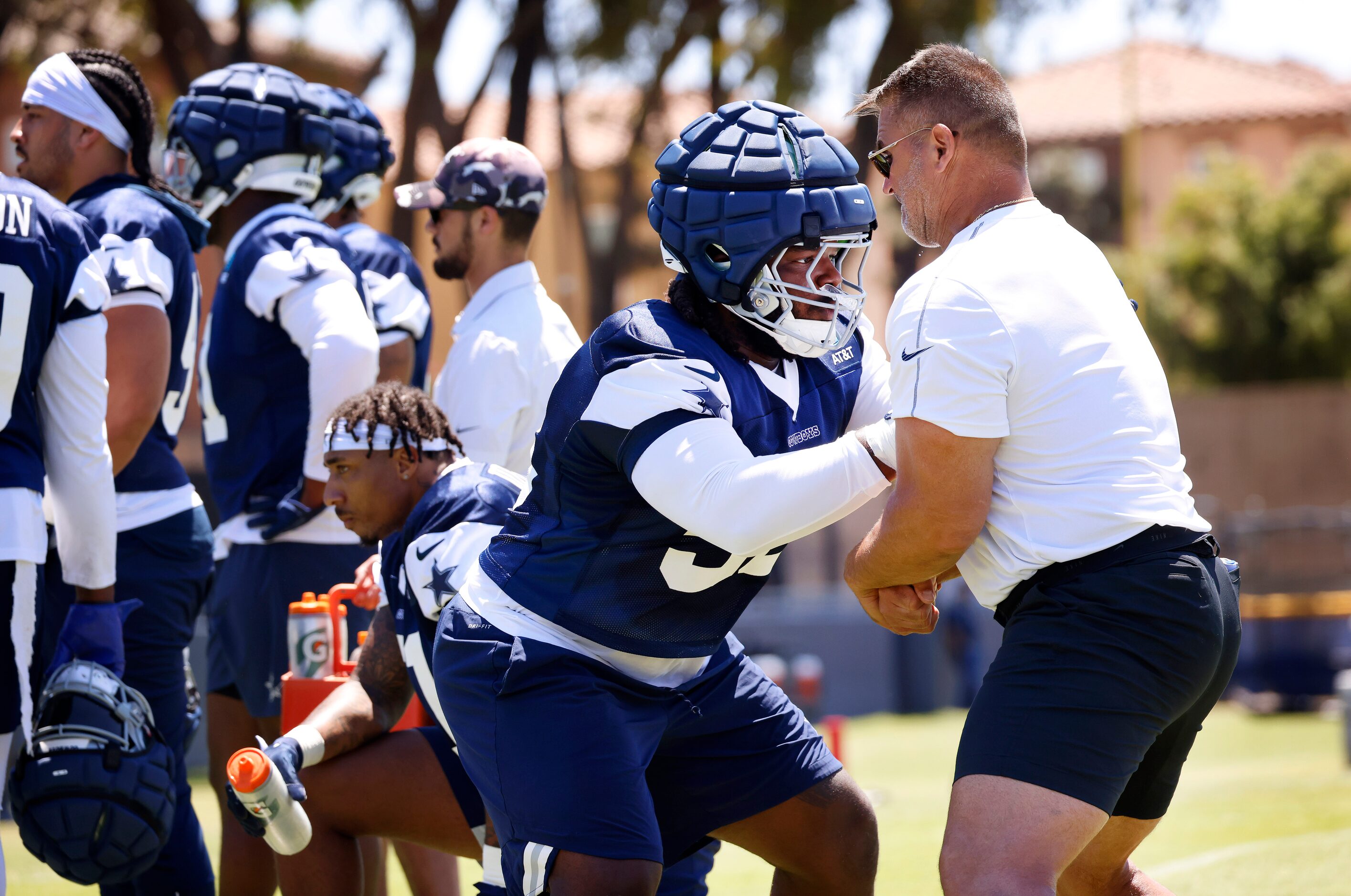 Dallas Cowboys defensive tackle Mazi Smith (58) works one-on-one with defensive line coach...