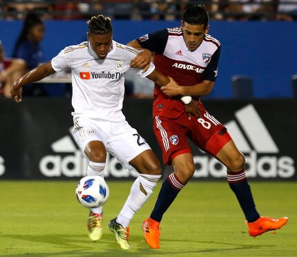 FC Dallas midfielder Victor Ulloa (8) holds onto Los Angeles FC forward Shaft Brewer Jr....