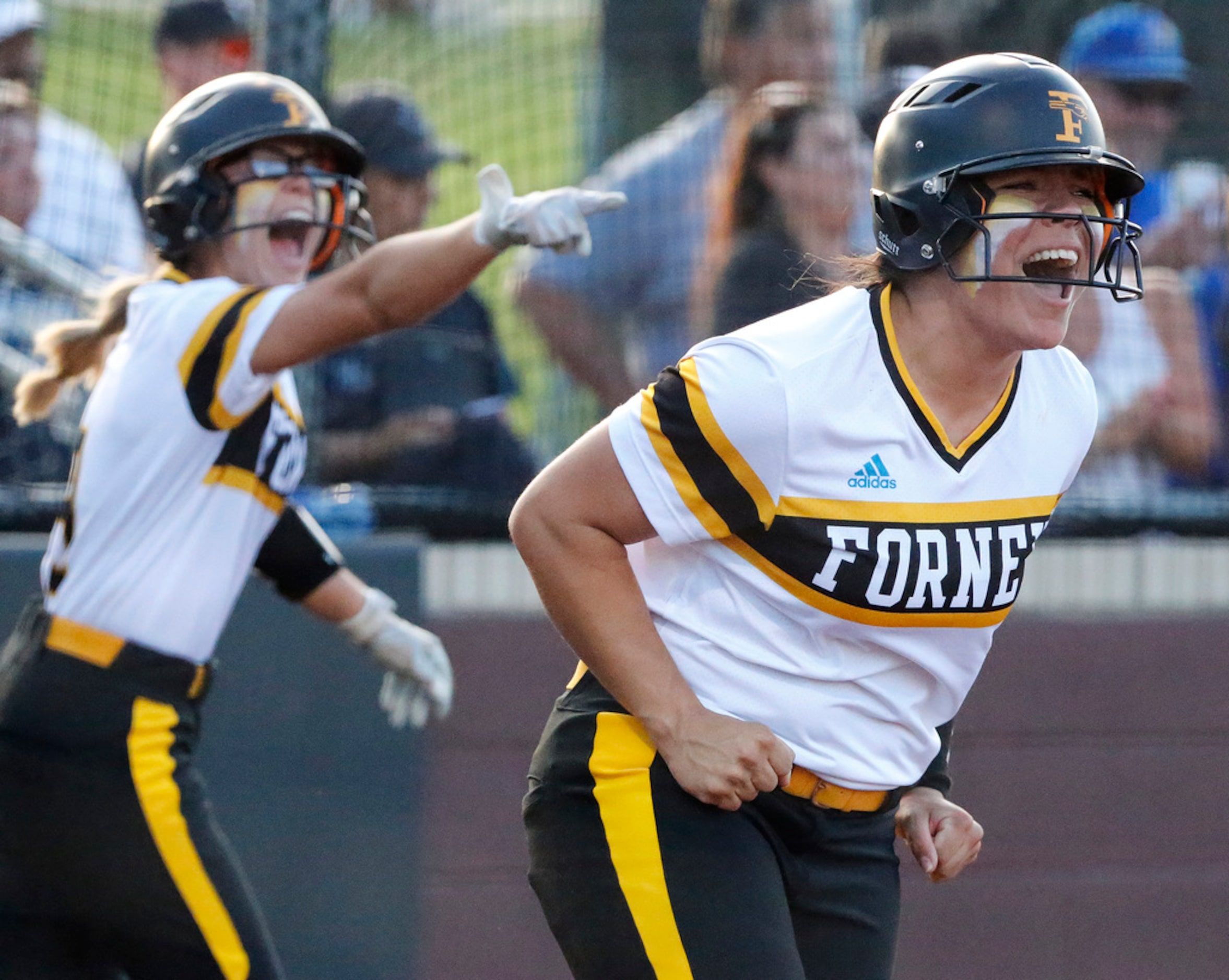 Forney High School second baseman Trinity Cannon (right) and outfielder Hannah Holdbrook...