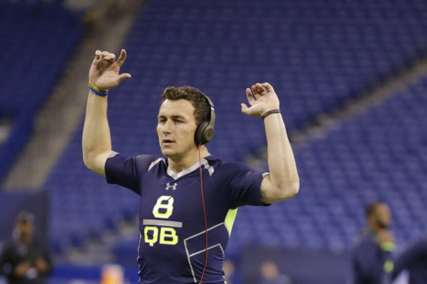 Texas A&M quarterback Johnny Manziel warms up at the NFL football scouting combine in...