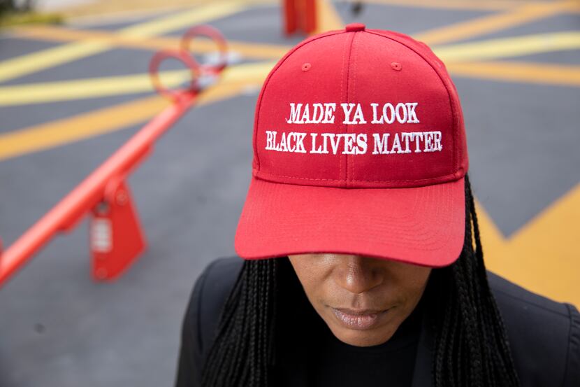 Shenita Cleveland wears her 'Made ya look Black lives matter" hat at Pacific Plaza in Dallas...
