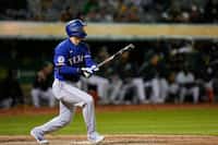Texas Rangers' Corey Seager watches his three-run home run against the Oakland Athletics...