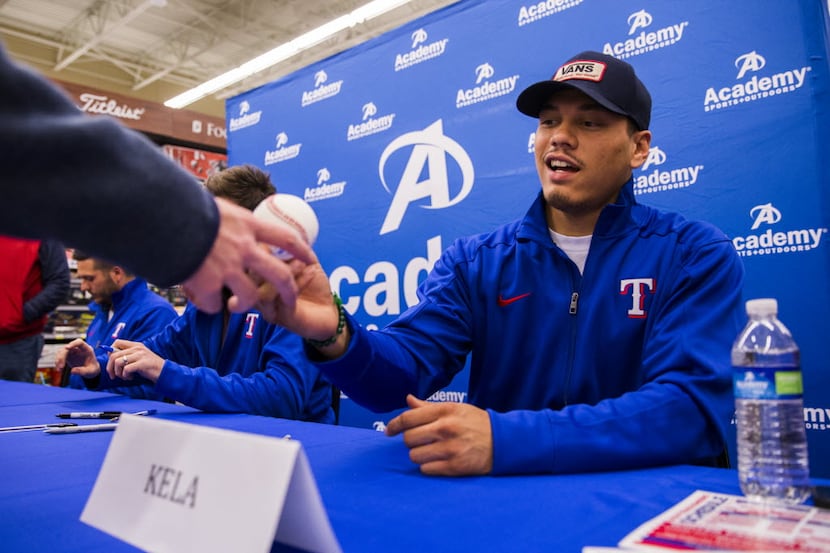 Texas Rangers pitcher Keone Kela signs autographs on Friday, January 8, 2016 at Academy...