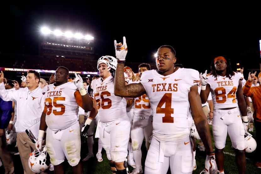 AMES, IA - SEPTEMBER 28: The Texas Longhorns celebrate their 17-7 win over the Iowa State...