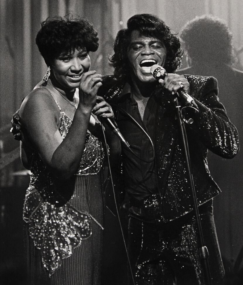 Soul singers James Brown and Aretha Franklin sing during a HBO taping at the Taboo night...