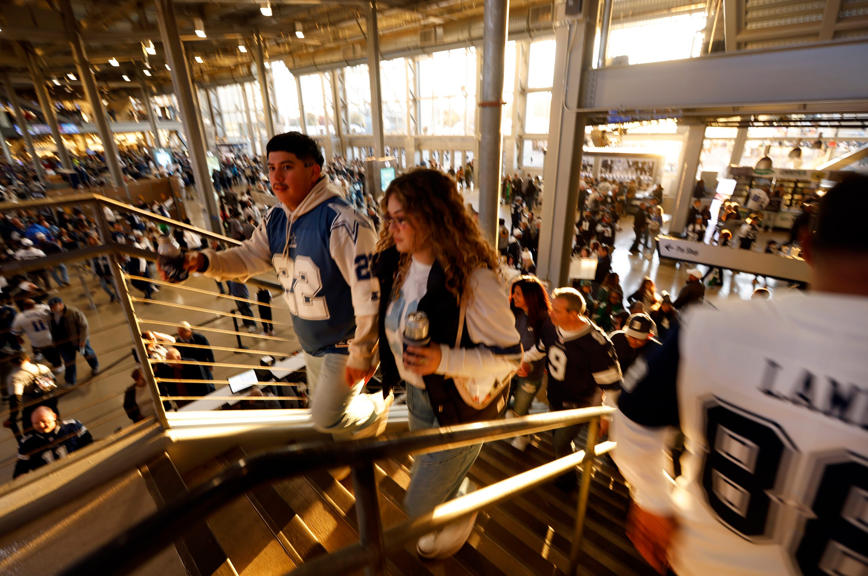 After the doors opened at 5pm, Dallas Cowboys fans hurry up the the stairs to a standing...