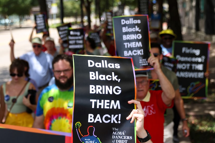 Signs that say "Dallas Black, BRING THEM BACK!" were held up by protesters during the rally...