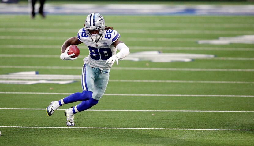 Cowboys wide receiver CeeDee Lamb (88) returns an onside kick for a touchdown in the fourth...