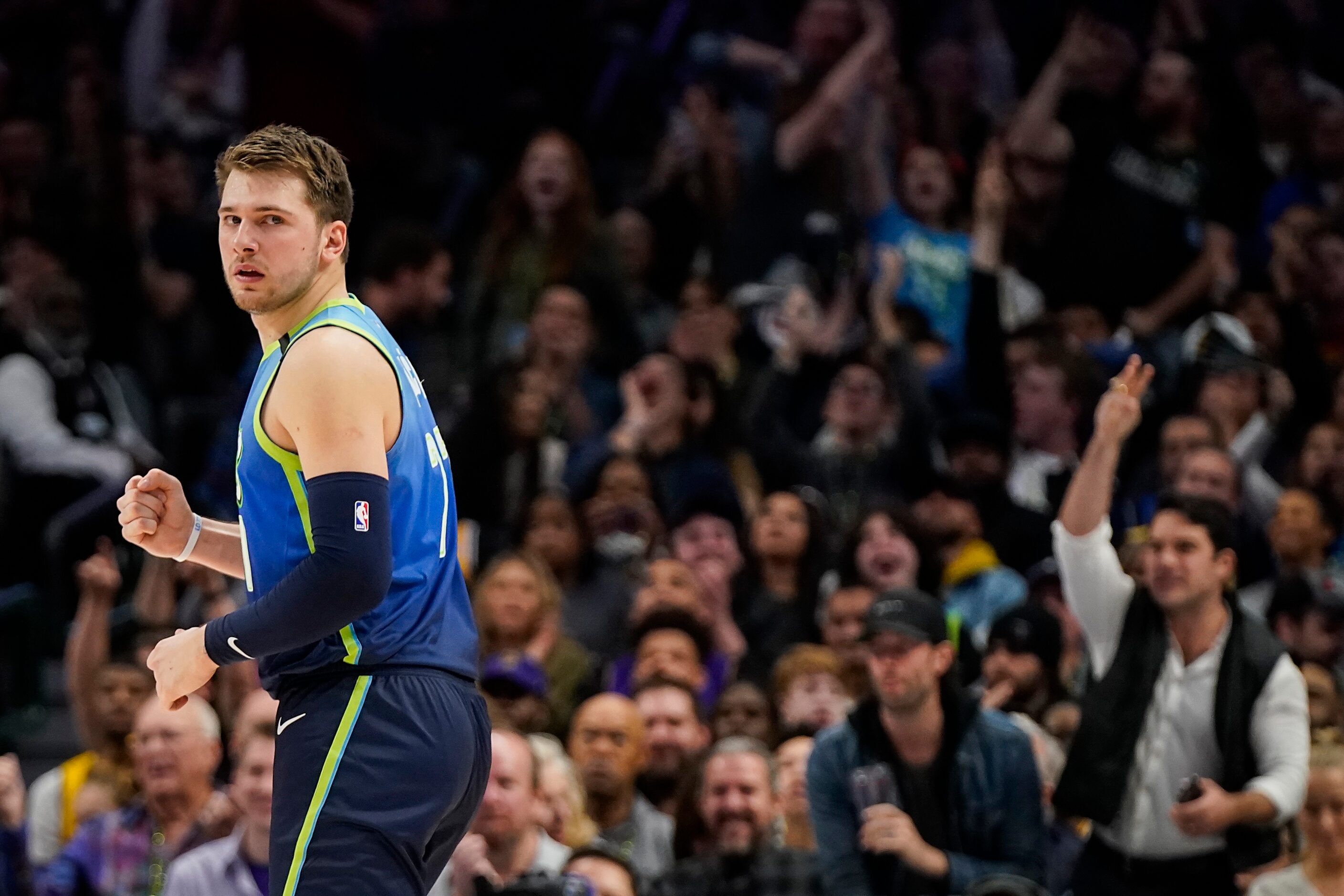 Dallas Mavericks guard Luka Doncic celebrates after making a 3-pointer during the first half...