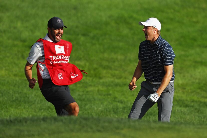 CROMWELL, CT - JUNE 25:  Jordan Spieth of the United States celebrates with caddie Michael...