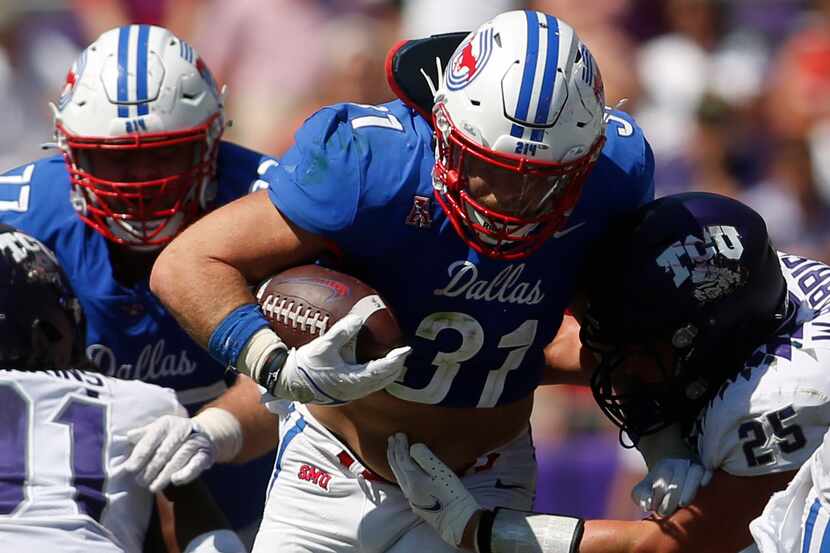 SMU running back Tyler Lavine (31) breaks into the secondary as TCU linebacker Wyatt Harris...