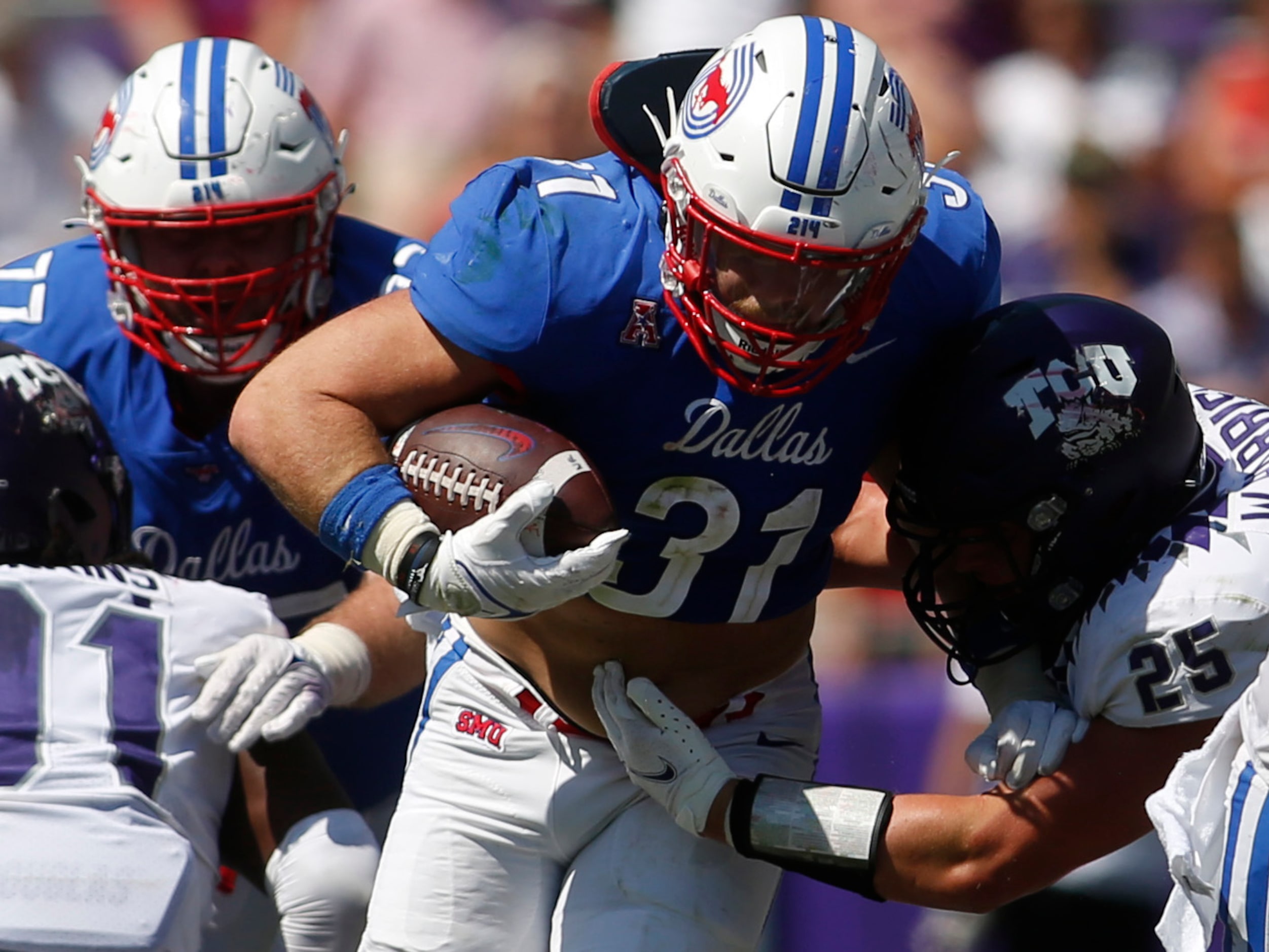 SMU running back Tyler Lavine (31) breaks into the secondary as TCU linebacker Wyatt Harris...