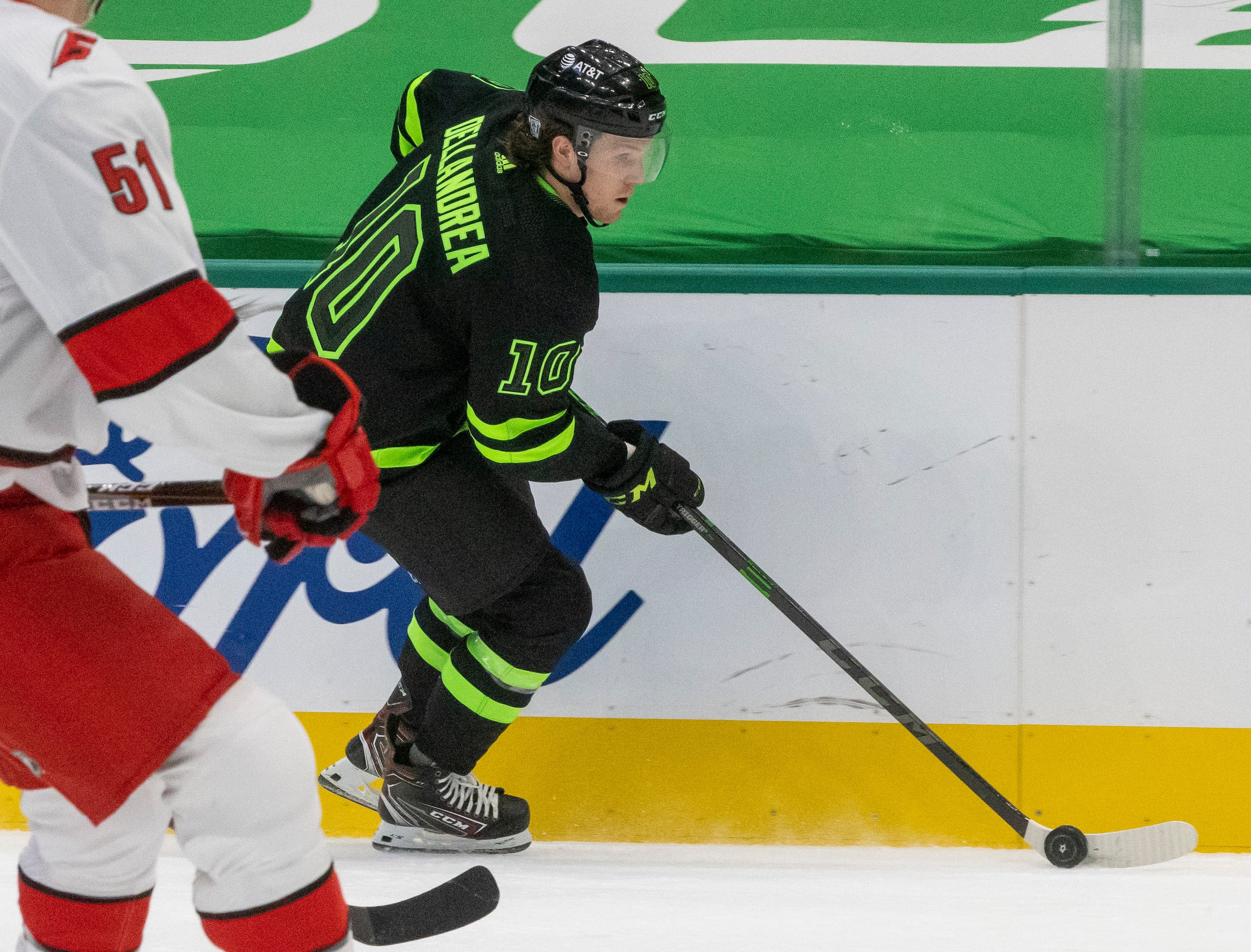 Dallas Stars center Ty Dellandrea (10) moves the puck down the ice during the first period...