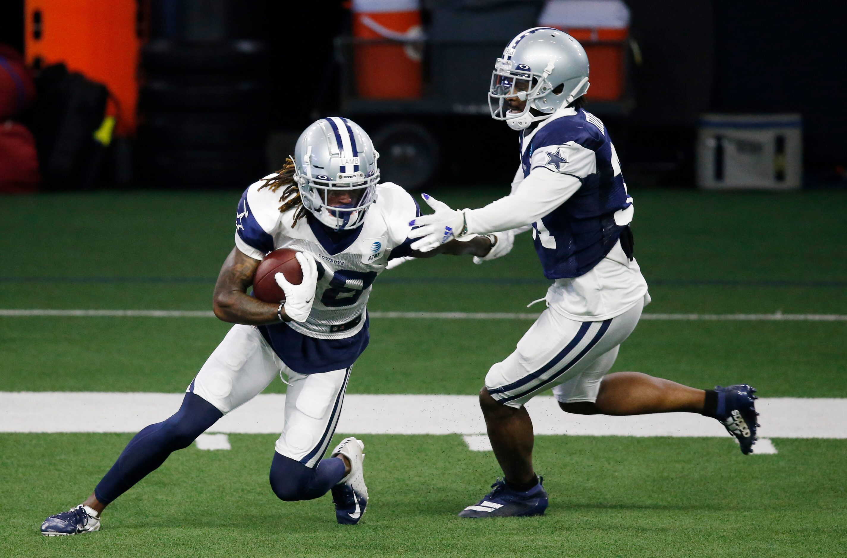 Dallas Cowboys wide receiver CeeDee Lamb (88) attempts to break away from Dallas Cowboys...