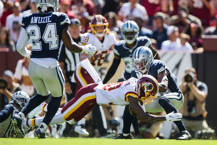 Dallas Cowboys cornerback Byron Jones (31) tries to stop Washington Redskins wide receiver...