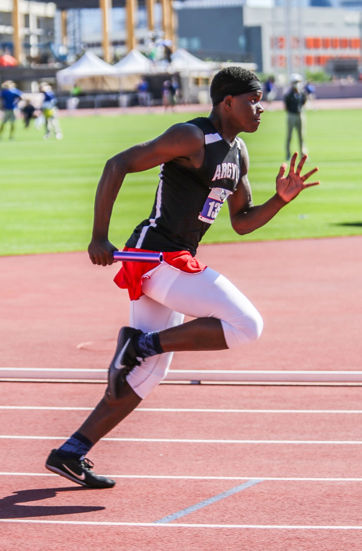 Argyle's Jaemael Felton runs with the baton during their 4A boys 4x100 relay at the UIL...