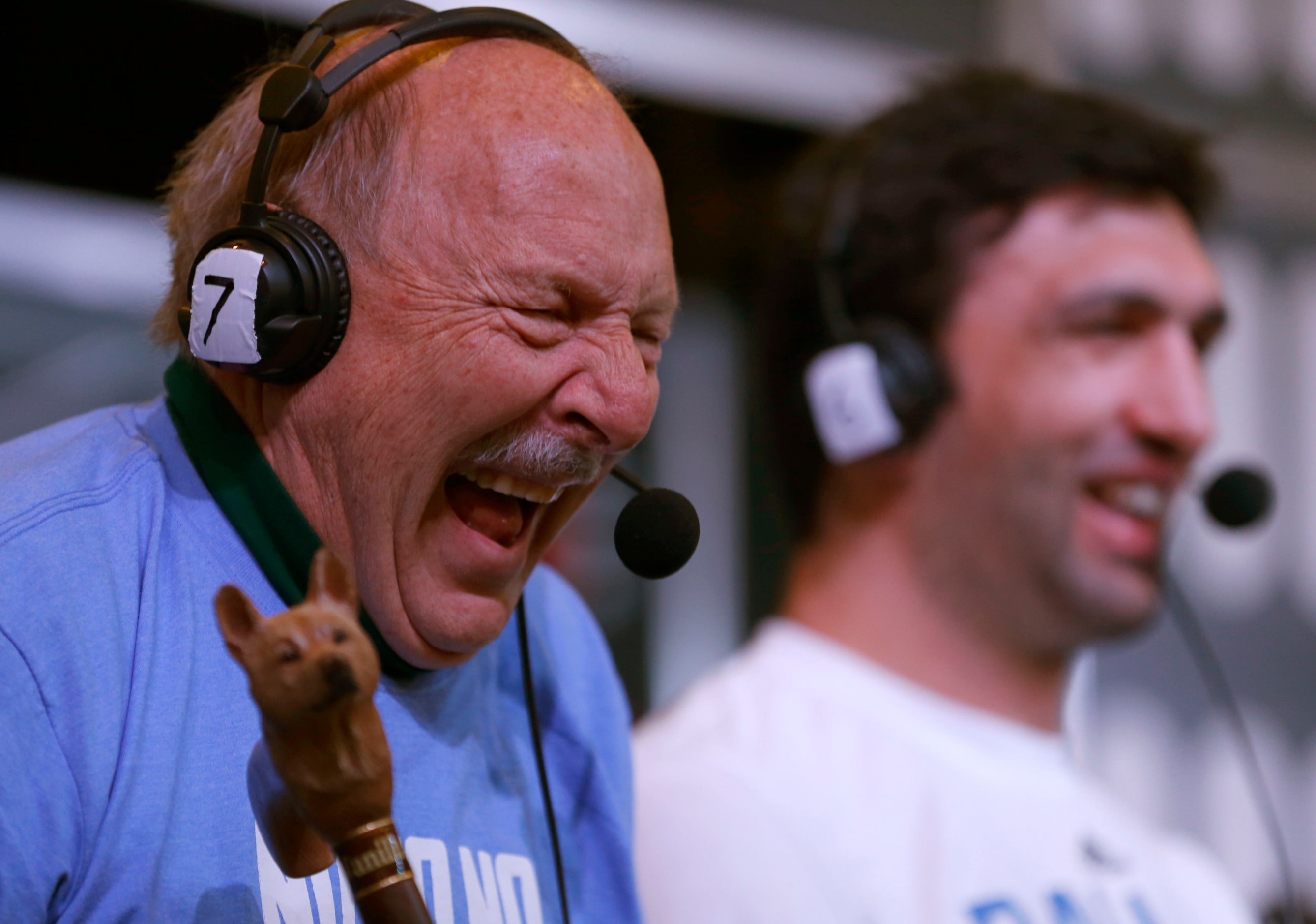 Norm Hitzges  laughs on air during a broadcast with Dallas Mavericks center Zaza Pachulia at...