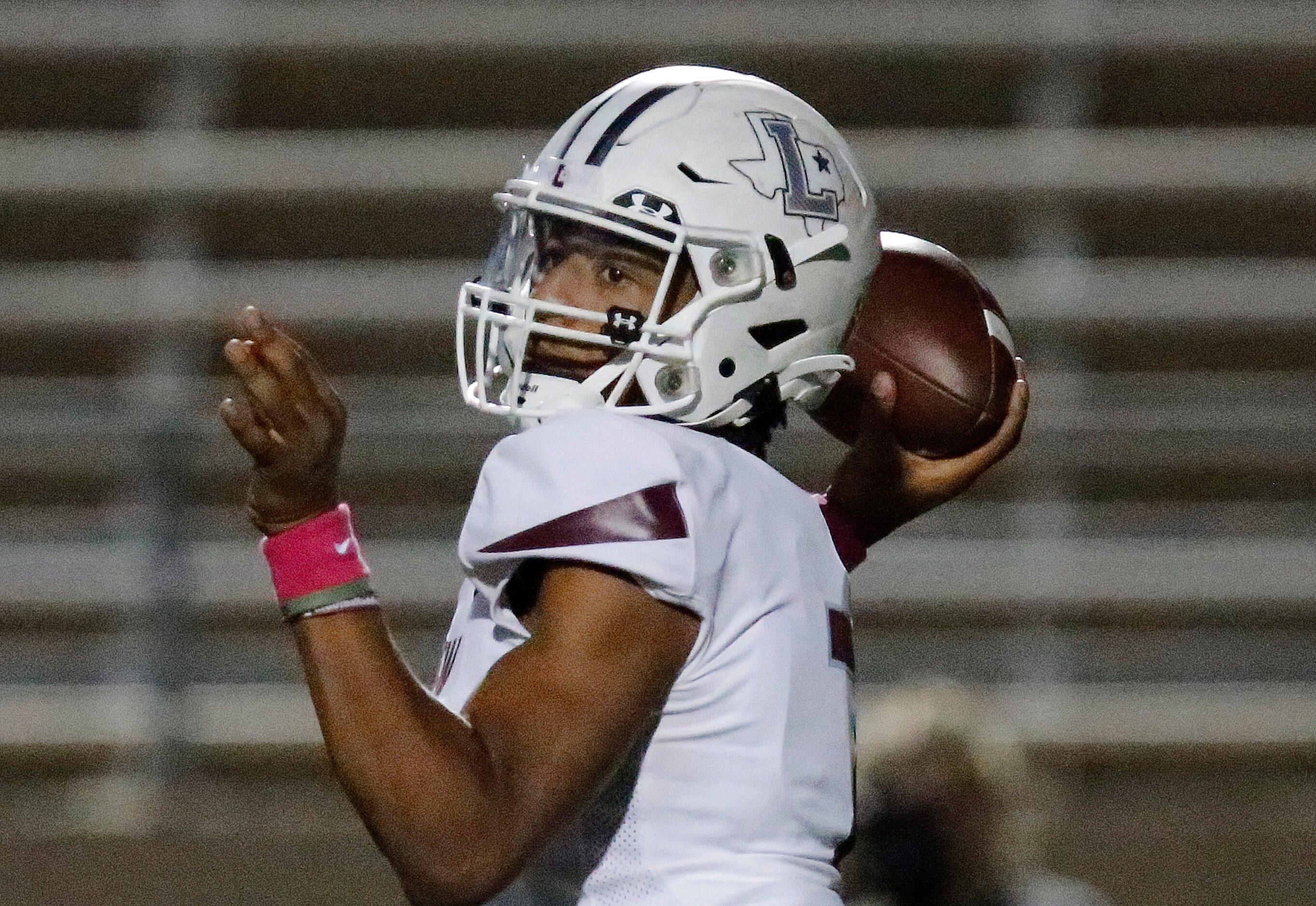 Lewisville High School quarterback Ethan Terrell (7) throws a pass during the first half as...