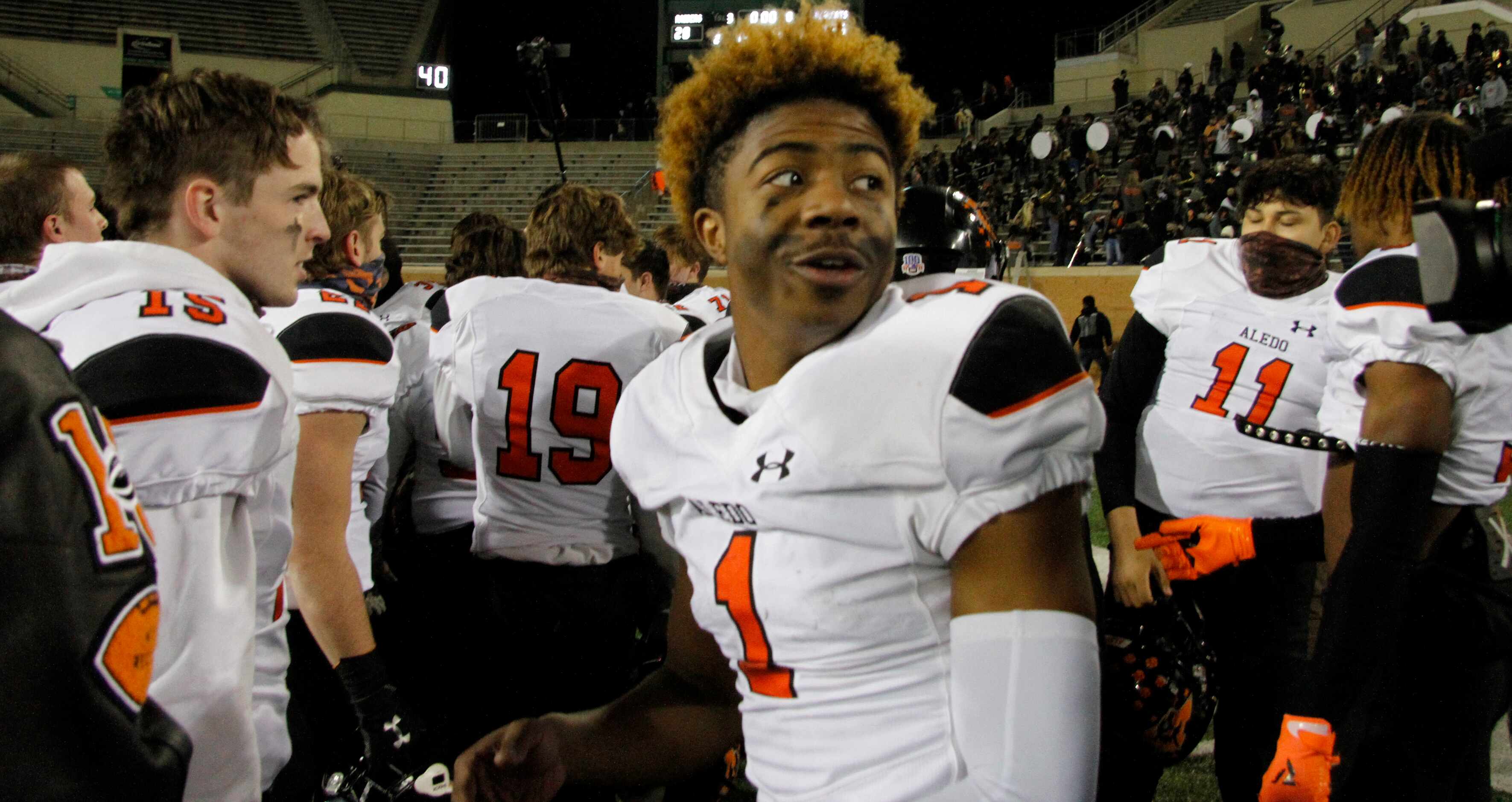 Aledo receiver JoJo Earle (1) turns to the sound of his name from fans in the stands after...