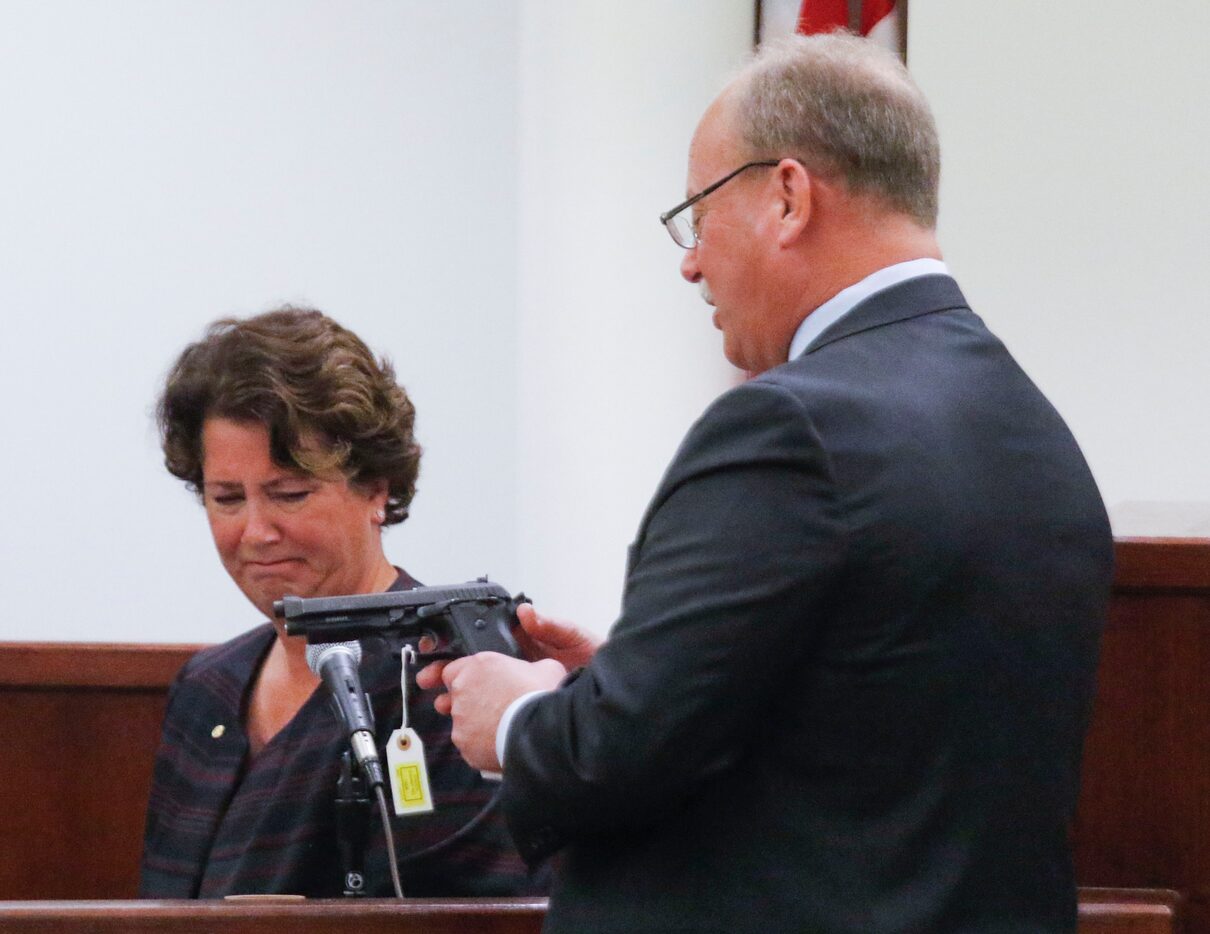 Jamie Becker, (left) a Firearm and Tool Mark Examiner with the Tarrant County Medical...