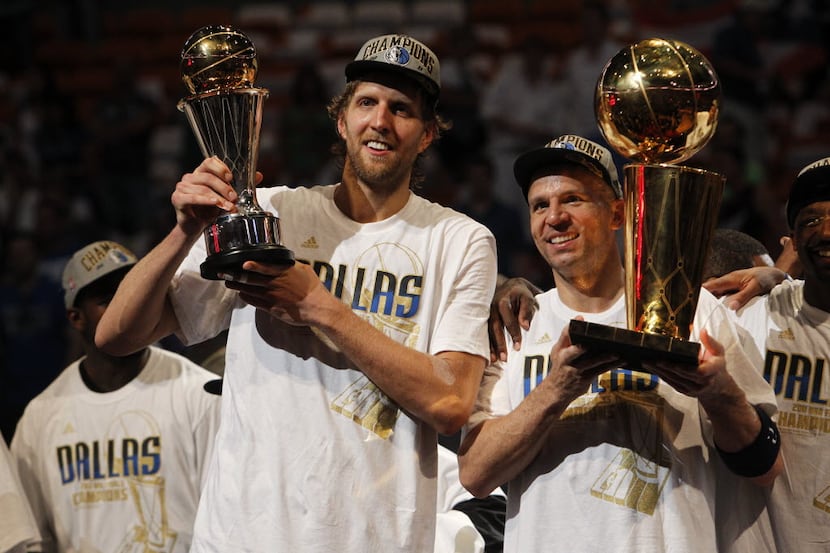 Dallas Mavericks power forward Dirk Nowitzki (41), holding the Bill Russell NBA Finals MVP...