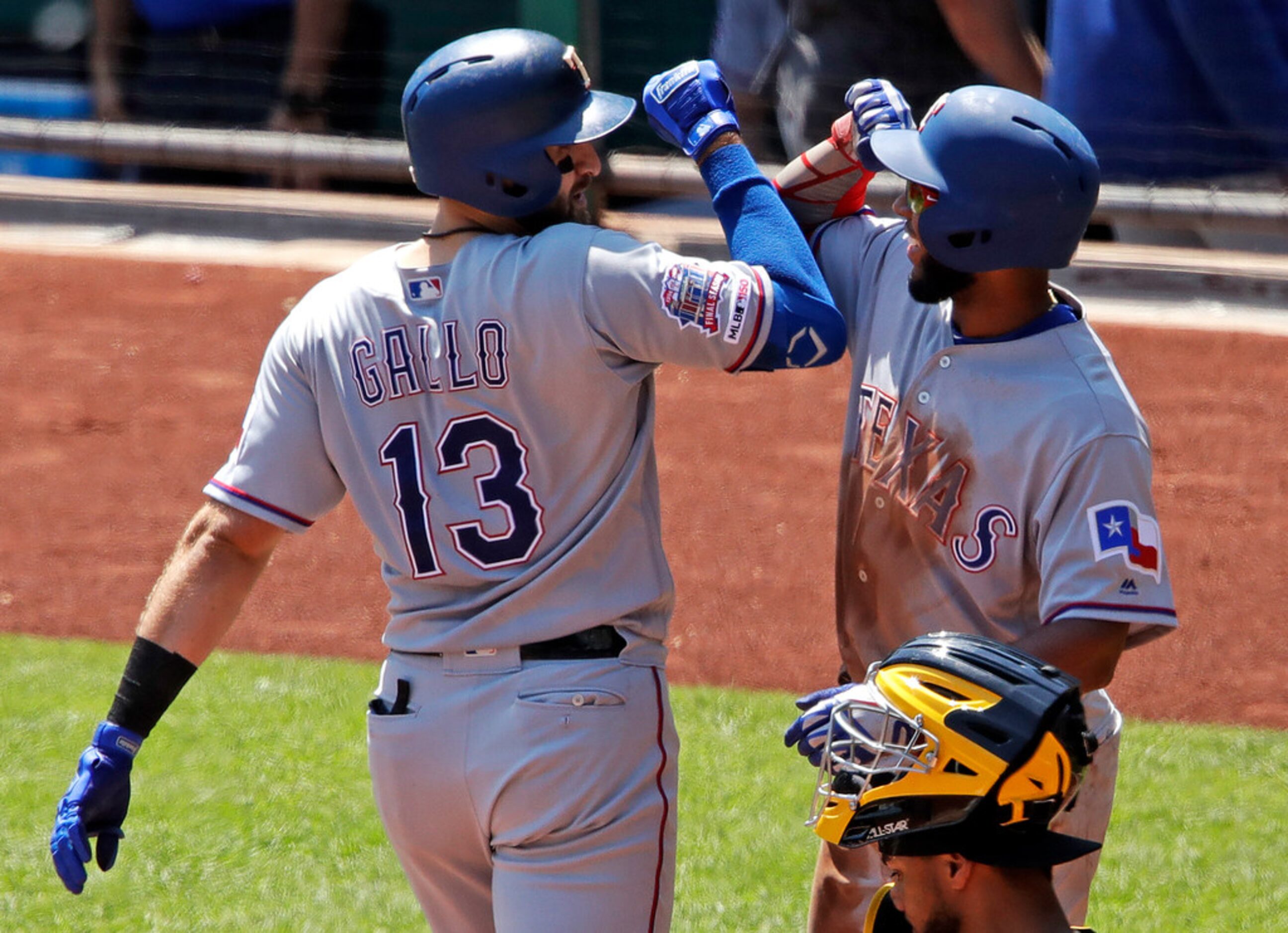 Texas Rangers' Joey Gallo (13) celebrates with Elvis Andrus after hitting a two-run home run...