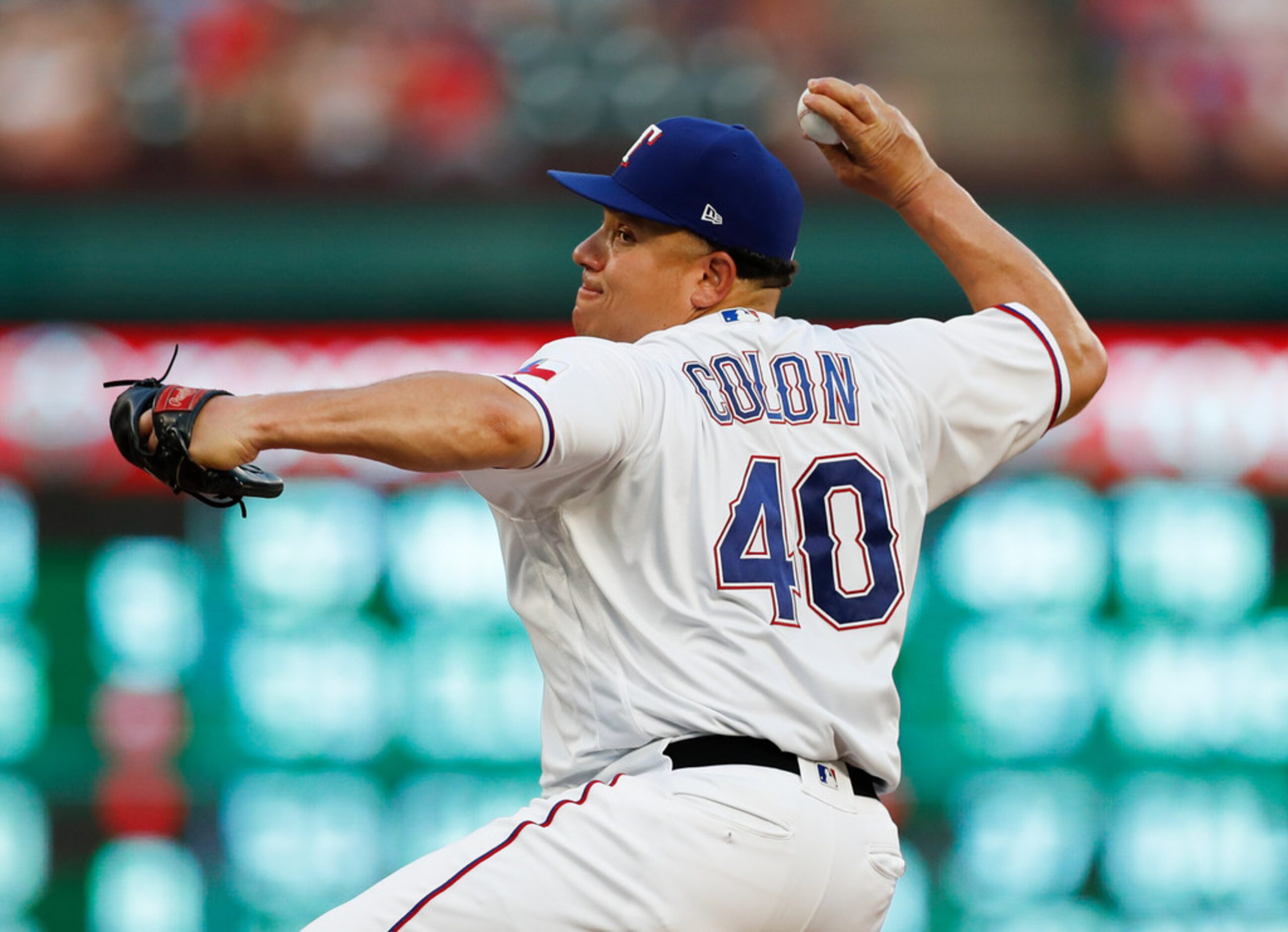 Texas Rangers starting pitcher Bartolo Colon (40) delivers a pitch to the Oakland Athletics...