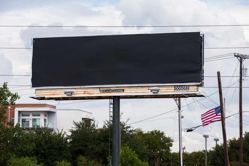A billboard was covered at the intersection of Preston Road and Bush Turnpike for what the...